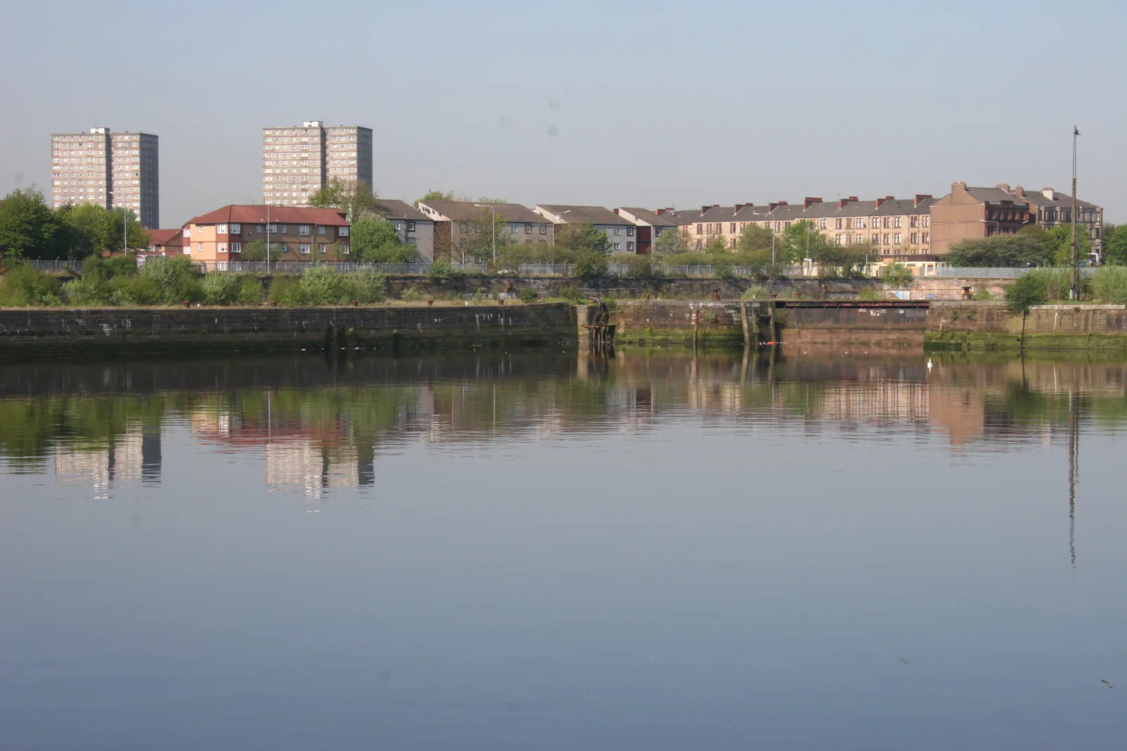 The disused stone dry docks and derelict pump house of Govan Graving Docks on the River Clyde