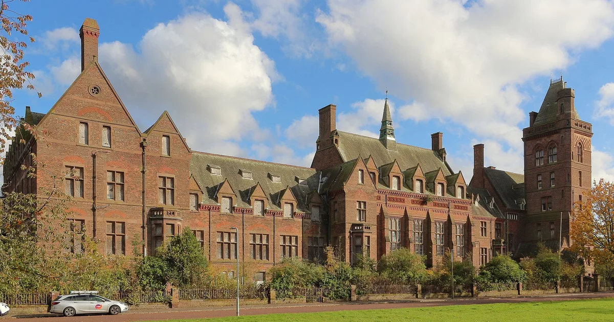 The vast red-brick Gothic facade of the abandoned Newsham Park Hospital in Liverpool