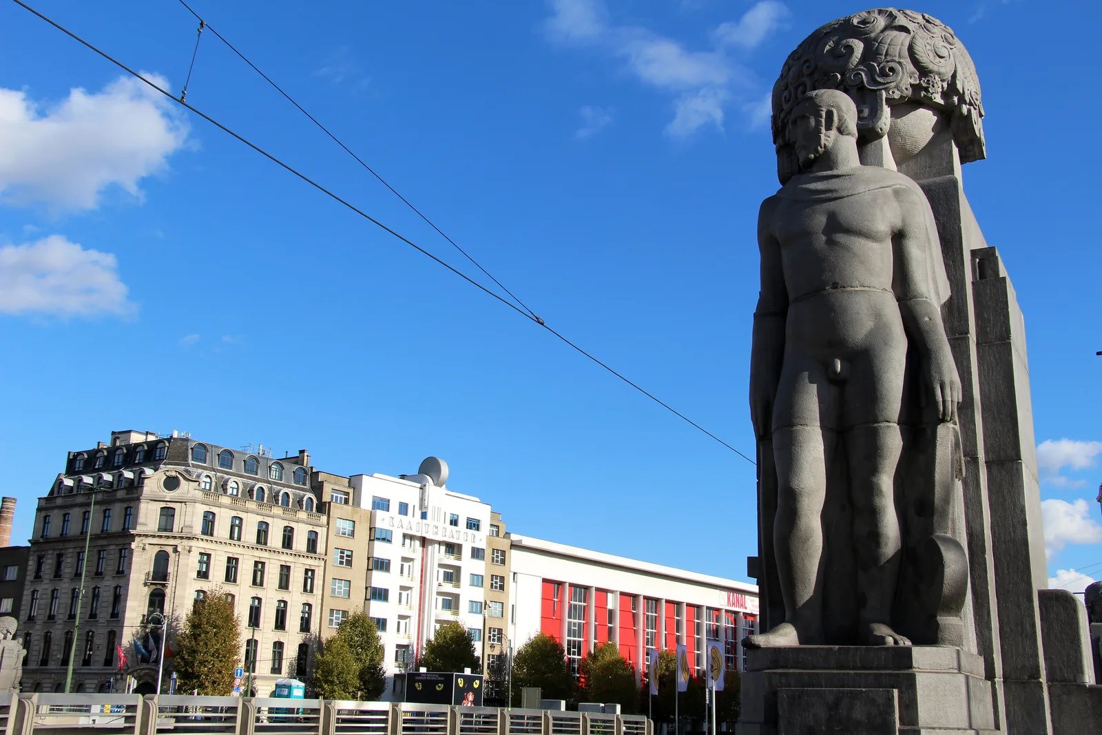 Art Deco statue and Sainctelette Bridge over the canal in Brussels, above the ghost metro station