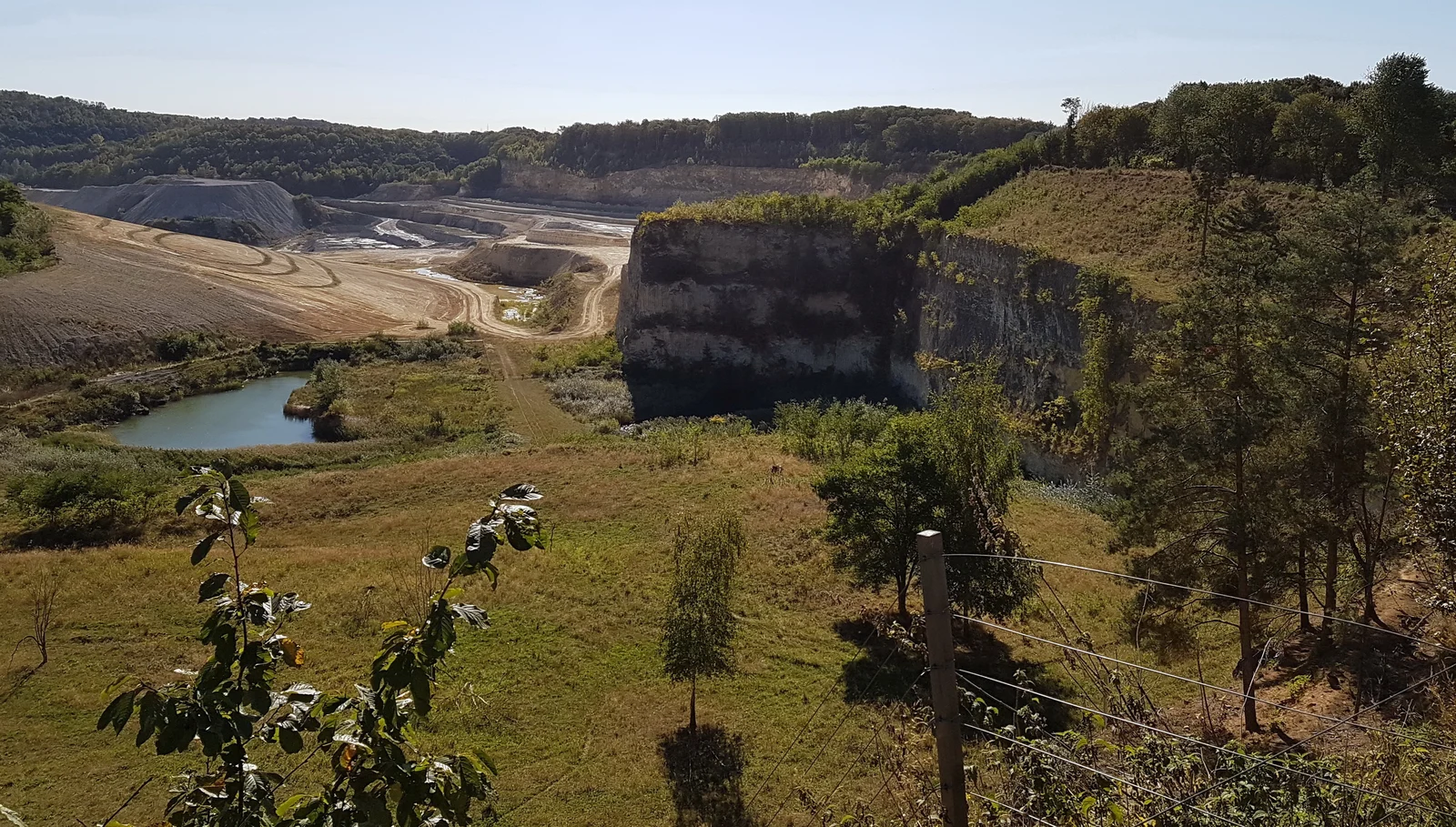 The white marl cliffs and turquoise lake of the abandoned ENCI marl quarry on the Sint-Pietersberg near Maastricht